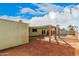 Spacious backyard featuring a covered patio, pool and shade structures at 1238 E Barcelona Ave, Casa Grande, AZ 85122