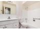 Bright, neutral bathroom with a single sink vanity and a shower-tub combination at 1238 E Barcelona Ave, Casa Grande, AZ 85122