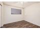 Bedroom featuring hardwood floors, ceiling fan and a window at 1238 E Barcelona Ave, Casa Grande, AZ 85122