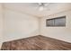 Bright bedroom with hardwood floors and a ceiling fan at 1238 E Barcelona Ave, Casa Grande, AZ 85122