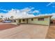 Inviting home with a spacious driveway and well-maintained exterior, perfect for Gathering living at 1238 E Barcelona Ave, Casa Grande, AZ 85122