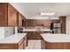 Traditional kitchen features stainless appliances and ample counter space at 1238 E Barcelona Ave, Casa Grande, AZ 85122