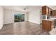 Open-concept living area with sleek floors leading to sliding glass doors and a view of the backyard at 1238 E Barcelona Ave, Casa Grande, AZ 85122
