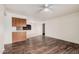 Comfortable living area with hardwood floors seamlessly connecting to the dining space at 1238 E Barcelona Ave, Casa Grande, AZ 85122