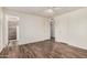 Bright main bedroom boasts hardwood floors and en-suite bathroom at 1238 E Barcelona Ave, Casa Grande, AZ 85122
