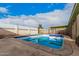 Inviting backyard pool with blue tile and concrete surround, perfect for relaxation at 1238 E Barcelona Ave, Casa Grande, AZ 85122