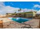 Backyard pool and patio area with surrounding fence, ideal for outdoor enjoyment at 1238 E Barcelona Ave, Casa Grande, AZ 85122