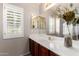Bright bathroom with double sinks and a large window at 13516 W Windsor Blvd, Litchfield Park, AZ 85340