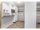 Walk-in closet with custom shelving for optimal storage at 13516 W Windsor Blvd, Litchfield Park, AZ 85340