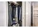 A well-organized walk-in closet with clothing and shelves at 13516 W Windsor Blvd, Litchfield Park, AZ 85340