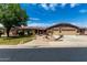 Charming single-story home with a well-manicured lawn, mature tree, and a spacious three-car garage at 13516 W Windsor Blvd, Litchfield Park, AZ 85340
