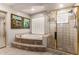 Beautiful bathroom featuring a soaking tub and separate glass shower at 13516 W Windsor Blvd, Litchfield Park, AZ 85340