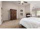 Bedroom features large wardrobe and gas fireplace at 13516 W Windsor Blvd, Litchfield Park, AZ 85340