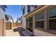 Small dirt backyard features stucco exterior and sliding glass doors at 14636 W Sand Hills Rd, Surprise, AZ 85387