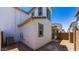 Stucco exterior with a small dirt backyard features sliding glass doors at 14636 W Sand Hills Rd, Surprise, AZ 85387
