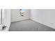 Bright bedroom with gray carpet and natural light from a window at 14636 W Sand Hills Rd, Surprise, AZ 85387