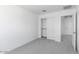 Bedroom featuring plush carpeting, closet, and a doorway at 14636 W Sand Hills Rd, Surprise, AZ 85387