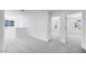 Open hallway area with neutral gray carpet and natural light from windows at 14636 W Sand Hills Rd, Surprise, AZ 85387