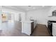 Kitchen featuring stainless appliances, a center island with sink, tiled floors, and an open layout at 14636 W Sand Hills Rd, Surprise, AZ 85387