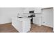 Kitchen featuring a center island with a sink and stainless steel appliances and white cabinets at 14636 W Sand Hills Rd, Surprise, AZ 85387