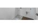 Empty laundry room with hookups, wood-look flooring, and white walls at 14636 W Sand Hills Rd, Surprise, AZ 85387