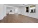 Open-concept living room featuring modern tiled floors and access to the kitchen at 14636 W Sand Hills Rd, Surprise, AZ 85387