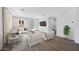 Bright living room with neutral tones, modern furniture, and a sliding glass door at 14636 W Sand Hills Rd, Surprise, AZ 85387