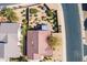 Aerial view showcases the home's landscaping and roof in context with the neighborhood at 15900 W Autumn Cir, Surprise, AZ 85374