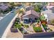 Aerial view showcases a desert landscaped backyard with a covered patio in a fenced yard at 15900 W Autumn Cir, Surprise, AZ 85374