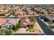 Aerial view of a single-story home with a well-manicured yard and a two-car garage in a residential area at 15900 W Autumn Cir, Surprise, AZ 85374