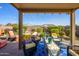 Cozy covered patio with comfortable seating, perfect for enjoying the outdoors and desert landscape at 15900 W Autumn Cir, Surprise, AZ 85374