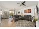 Bright, open living space with modern furniture, stylish decor, and hardwood floors at 15900 W Autumn Cir, Surprise, AZ 85374