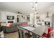 Open concept living space featuring a modern dining area, cozy living room, and bright kitchen at 15900 W Autumn Cir, Surprise, AZ 85374