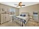Cozy bedroom with natural light, ceiling fan, and a neutral decor at 18902 W Clinton St, Surprise, AZ 85388