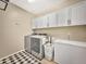 Convenient laundry room with modern appliances and ample storage space at 18902 W Clinton St, Surprise, AZ 85388