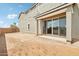 Backyard with sliding glass door, concrete patio, and a blank canvas for landscaping at 1978 W Lariat Ln, Phoenix, AZ 85085