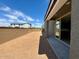 Spacious backyard area with block fence and sliding glass door access at 1978 W Lariat Ln, Phoenix, AZ 85085