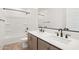 Bathroom features dual sinks, a tub, and modern black fixtures that enhance the space's look at 1978 W Lariat Ln, Phoenix, AZ 85085