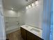 Bathroom featuring double sinks, modern lighting, and a tub-shower combination at 1978 W Lariat Ln, Phoenix, AZ 85085