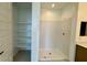 Bathroom featuring a walk-in shower and open shelving, maximizing storage space at 1978 W Lariat Ln, Phoenix, AZ 85085