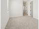 Bright, carpeted bedroom with neutral walls, a window with blinds, and access to other rooms at 1978 W Lariat Ln, Phoenix, AZ 85085