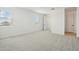 Spacious bedroom with plush carpet, bright natural light, and a view of the hallway and exterior at 1978 W Lariat Ln, Phoenix, AZ 85085
