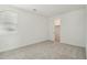 Well-lit bedroom with plush carpeting, featuring a closet with sliding doors for ample storage at 1978 W Lariat Ln, Phoenix, AZ 85085