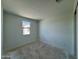 Bedroom with a window providing neighborhood views and natural light at 1978 W Lariat Ln, Phoenix, AZ 85085