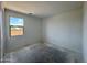 Bright bedroom with a window offering natural light and a view of the outdoors at 1978 W Lariat Ln, Phoenix, AZ 85085