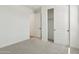 Neutral bedroom with closet, carpet, and plenty of light at 1978 W Lariat Ln, Phoenix, AZ 85085