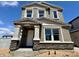Beautiful two-story home with stone accents and neutral stucco under a brilliant blue sky at 1978 W Lariat Ln, Phoenix, AZ 85085