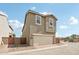 Exterior of home with two-car garage, brown stucco, and tile roof at 1978 W Lariat Ln, Phoenix, AZ 85085
