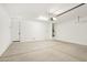 Spacious and well-lit garage with concrete floor, ready for vehicles and storage at 1978 W Lariat Ln, Phoenix, AZ 85085