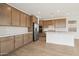 Large kitchen with an island, subway tile, and stainless steel appliances provides a great cooking experience at 1978 W Lariat Ln, Phoenix, AZ 85085